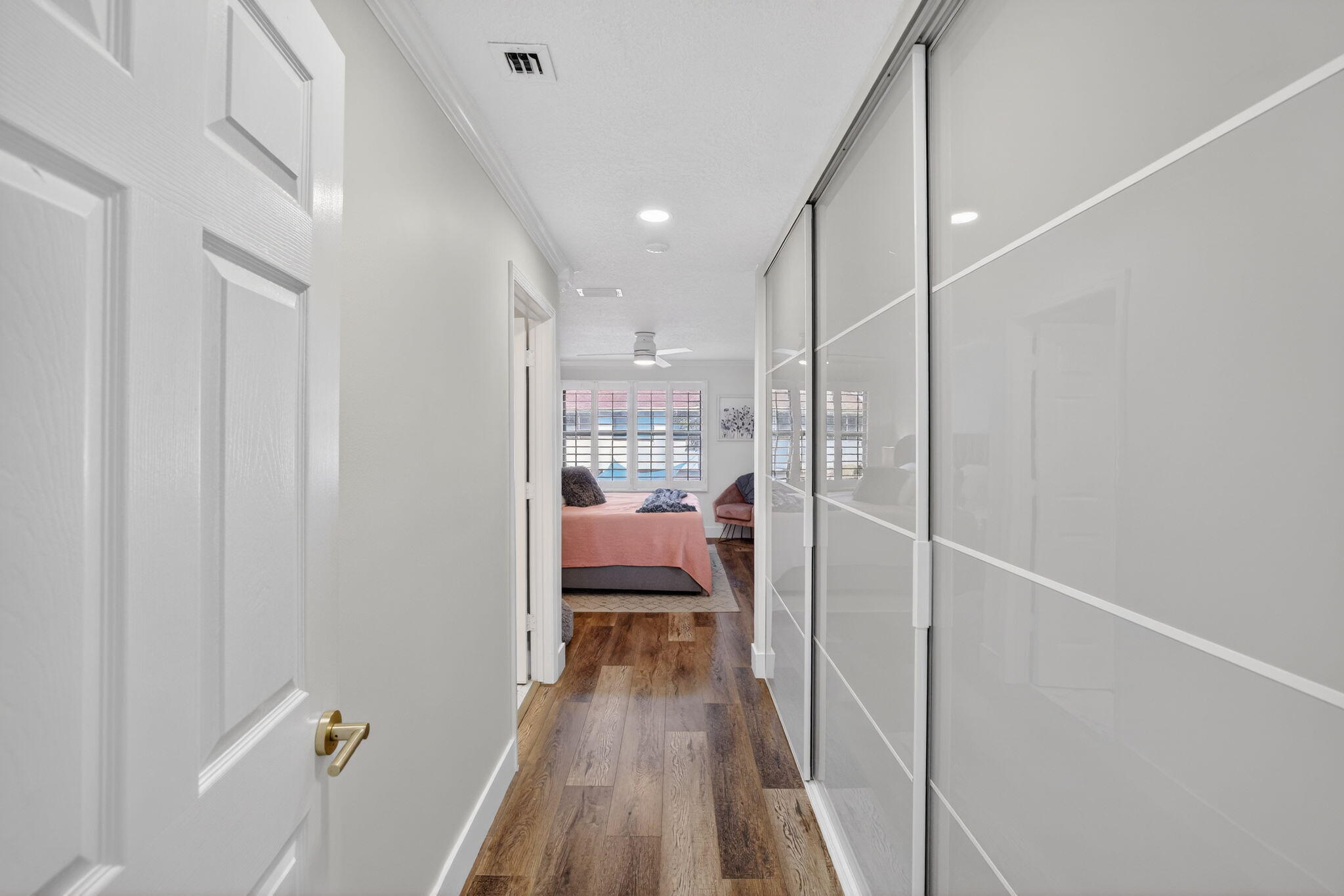 237 City View Drive, Unit 237 Fort Lauderdale, FL 33311 - Photo 32 of 81 a view of a hallway with a chair and wooden floor