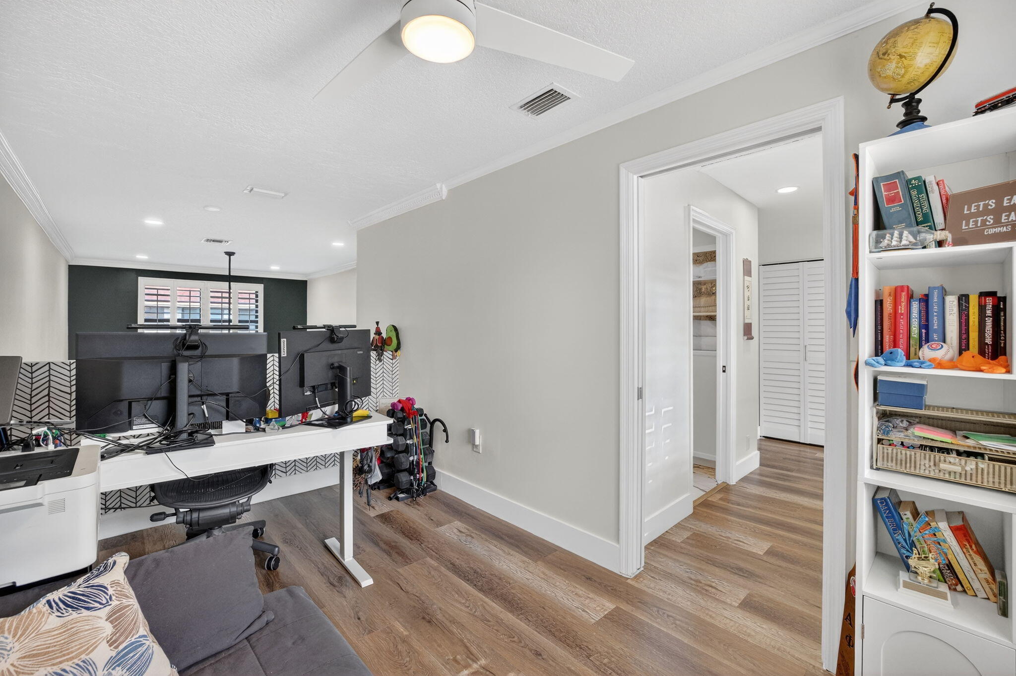237 City View Drive, Unit 237 Fort Lauderdale, FL 33311 - Photo 50 of 81 a view of a workspace with furniture and wooden floor