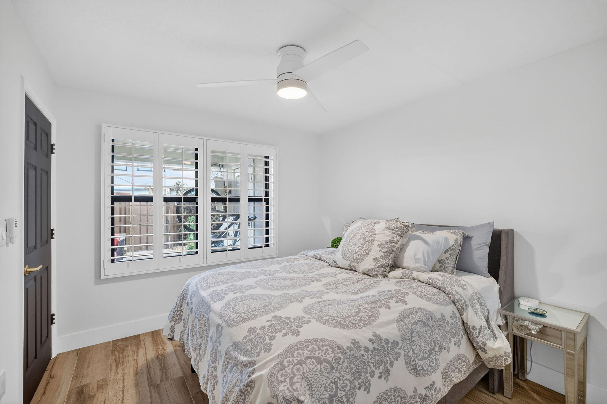 237 City View Drive, Unit 237 Fort Lauderdale, FL 33311 - Photo 53 of 81 a bedroom with a large bed and a large window