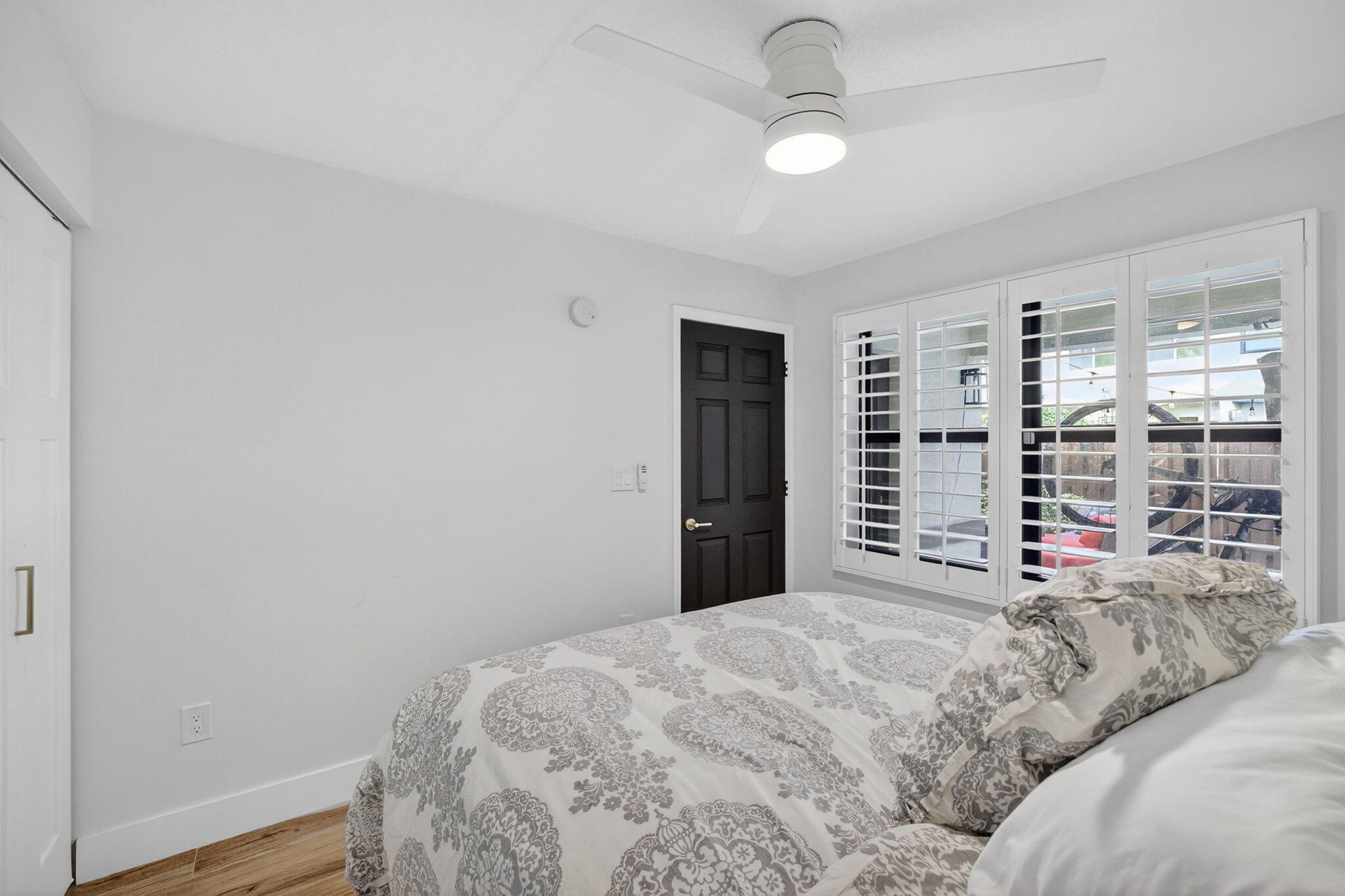 237 City View Drive, Unit 237 Fort Lauderdale, FL 33311 - Photo 54 of 81 a bedroom with a large bed and a chandelier