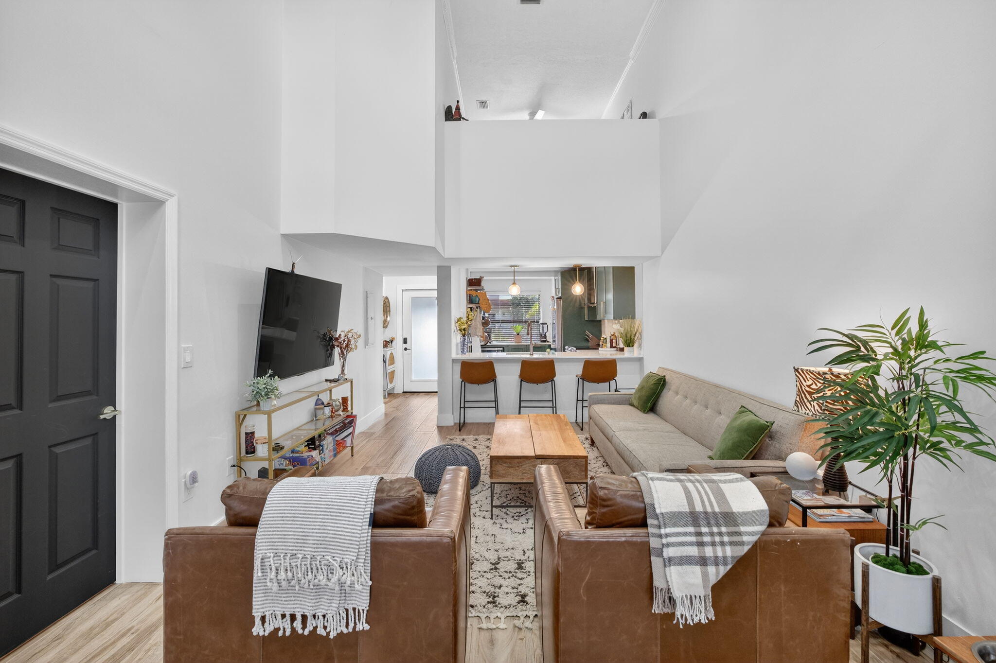237 City View Drive, Unit 237 Fort Lauderdale, FL 33311 - Photo 9 of 81 a living room with furniture a flat screen tv and a large window