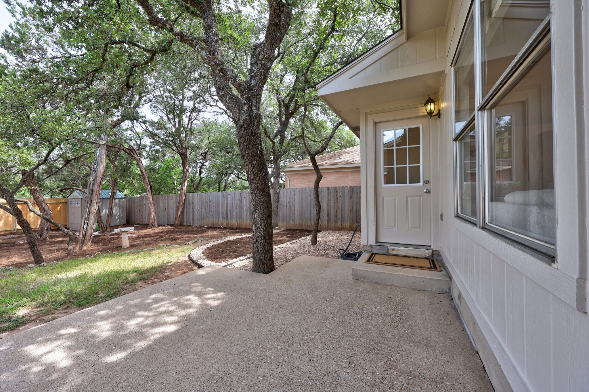 8219 Edgemoor Place Austin, TX 78749 - Photo 25 of 30 Mature trees canopy the backyard providing shade and privacy on a summer day.