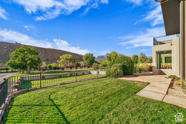 101 Chuckwalla Lane Springdale, UT 84767 - Photo 43 of 51 Fenced backyard featuring a patio area, a mountain view, and a balcony