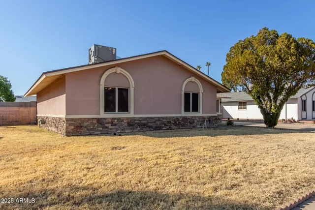 a view of large house with a yard