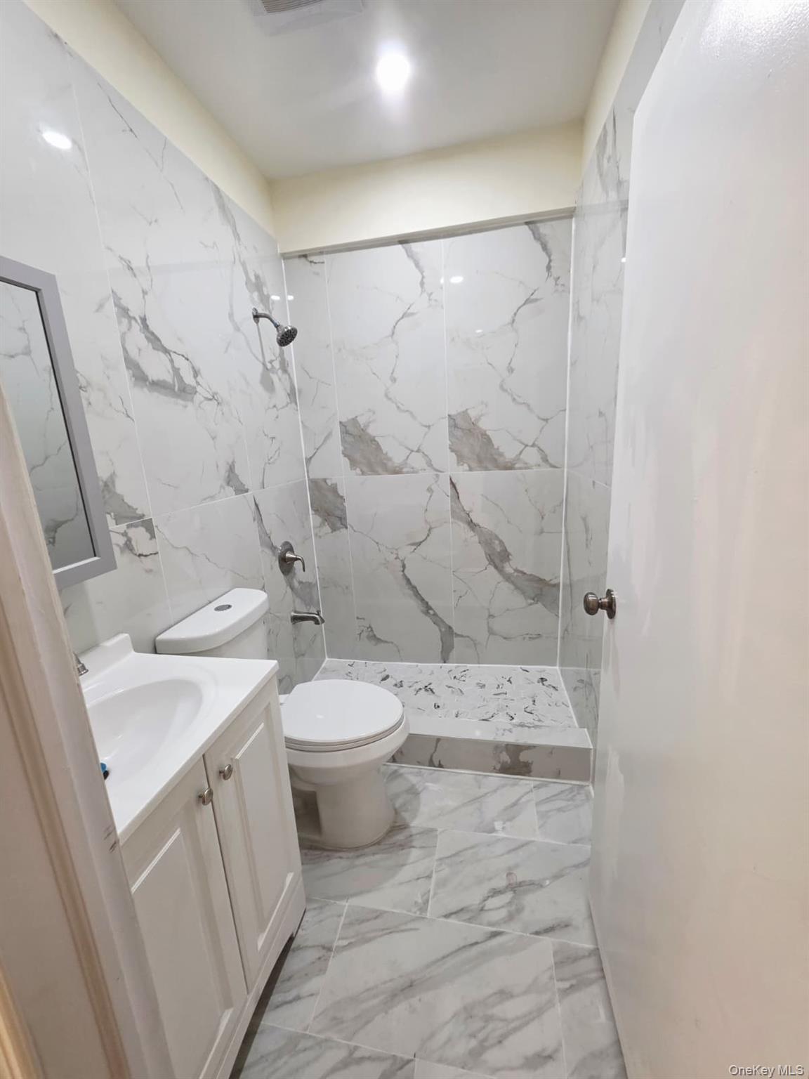 117-10 Jamaica Avenue, Unit 2A Queens, NY 11418 - Photo 3 of 4 a bathroom with a toilet sink and shower