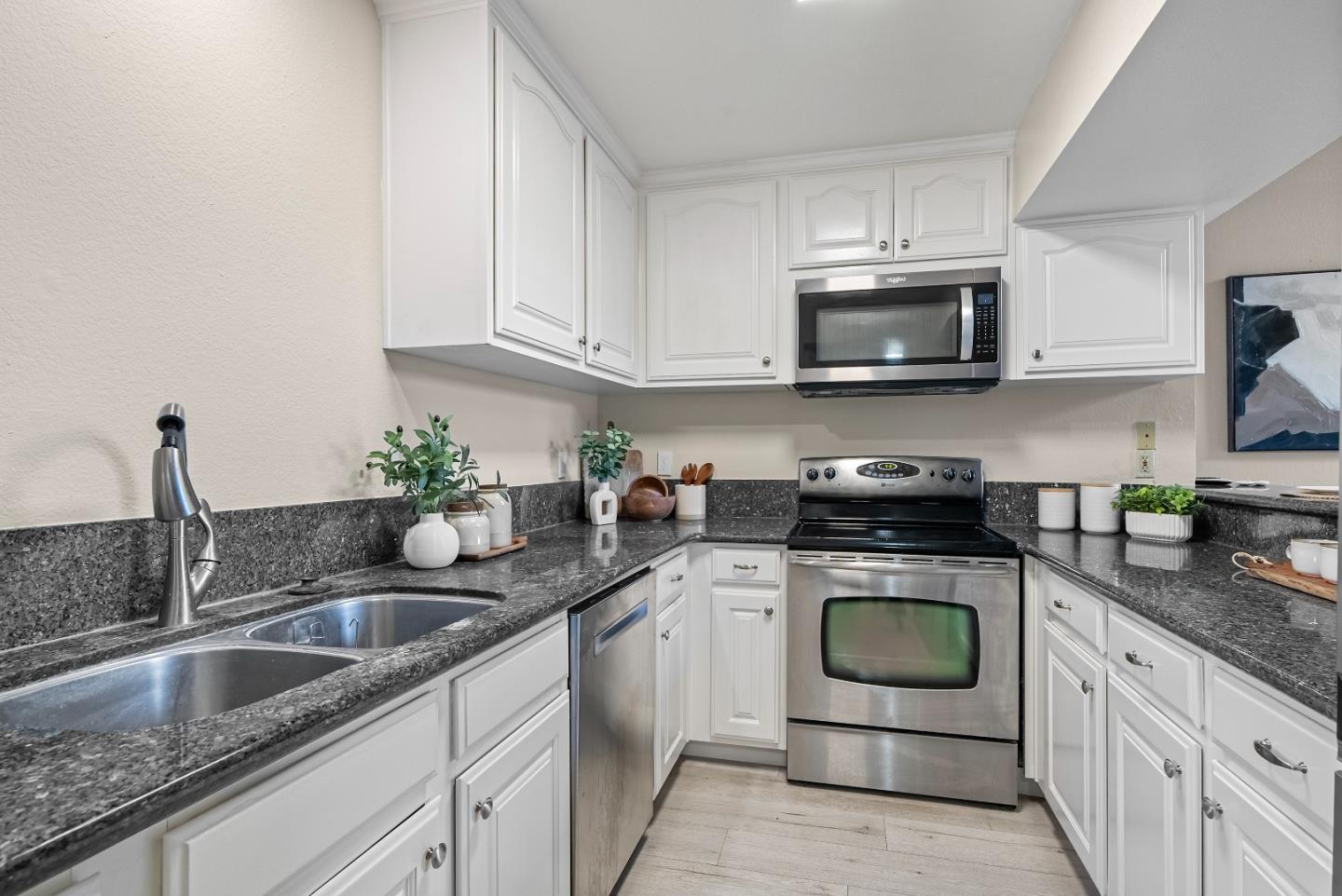 966 Silicon Drive San Jose, CA 95126 - Photo 8 of 31 a kitchen with granite countertop a sink stove and microwave