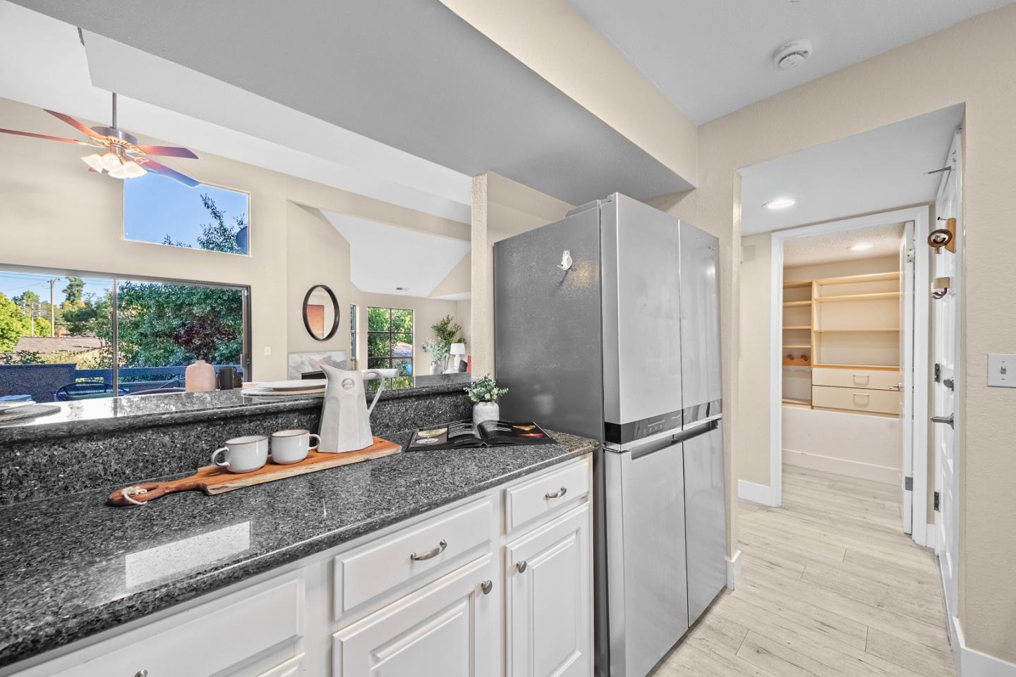 966 Silicon Drive San Jose, CA 95126 - Photo 9 of 31 a kitchen with granite countertop a refrigerator and a sink