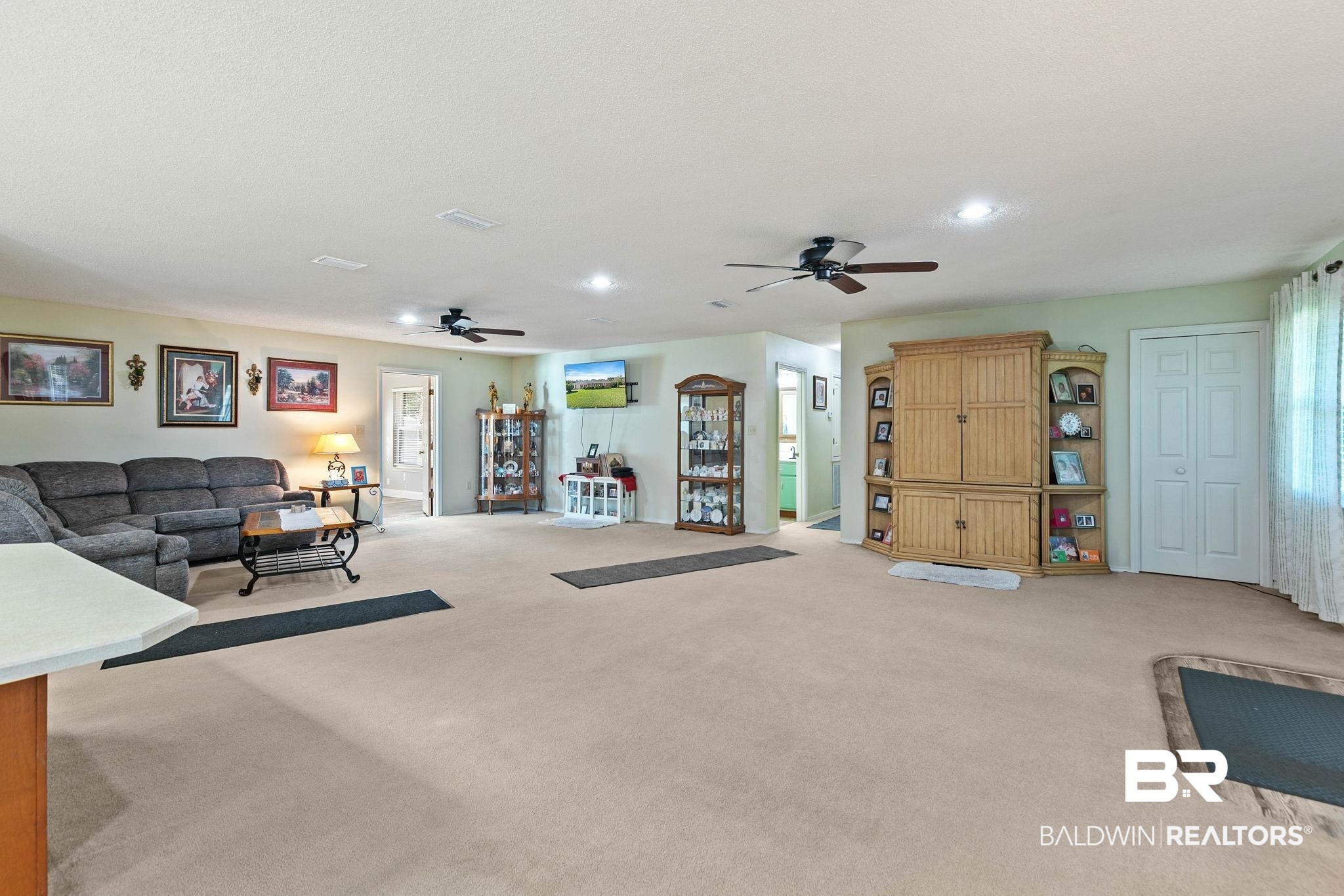 1510 South Juniper Street Foley, AL 36535 - Photo 9 of 36 Living room featuring ceiling fan, light colored carpet, and recessed lighting