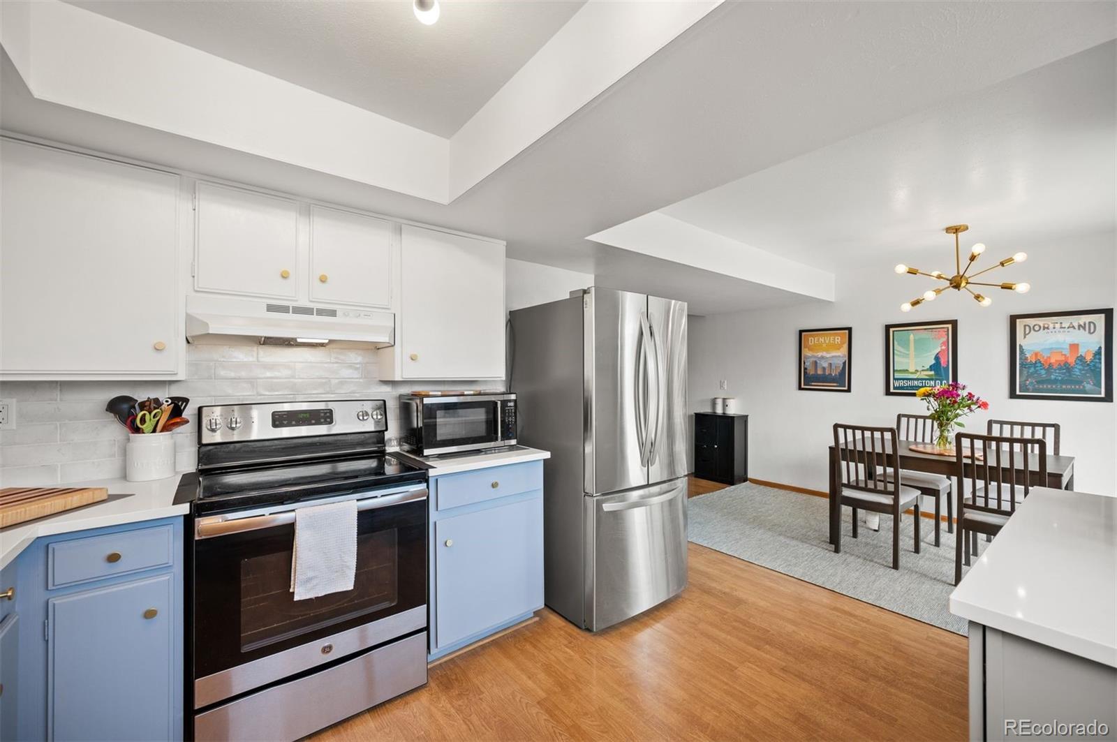 a kitchen with wooden cabinets and stainless steel appliances