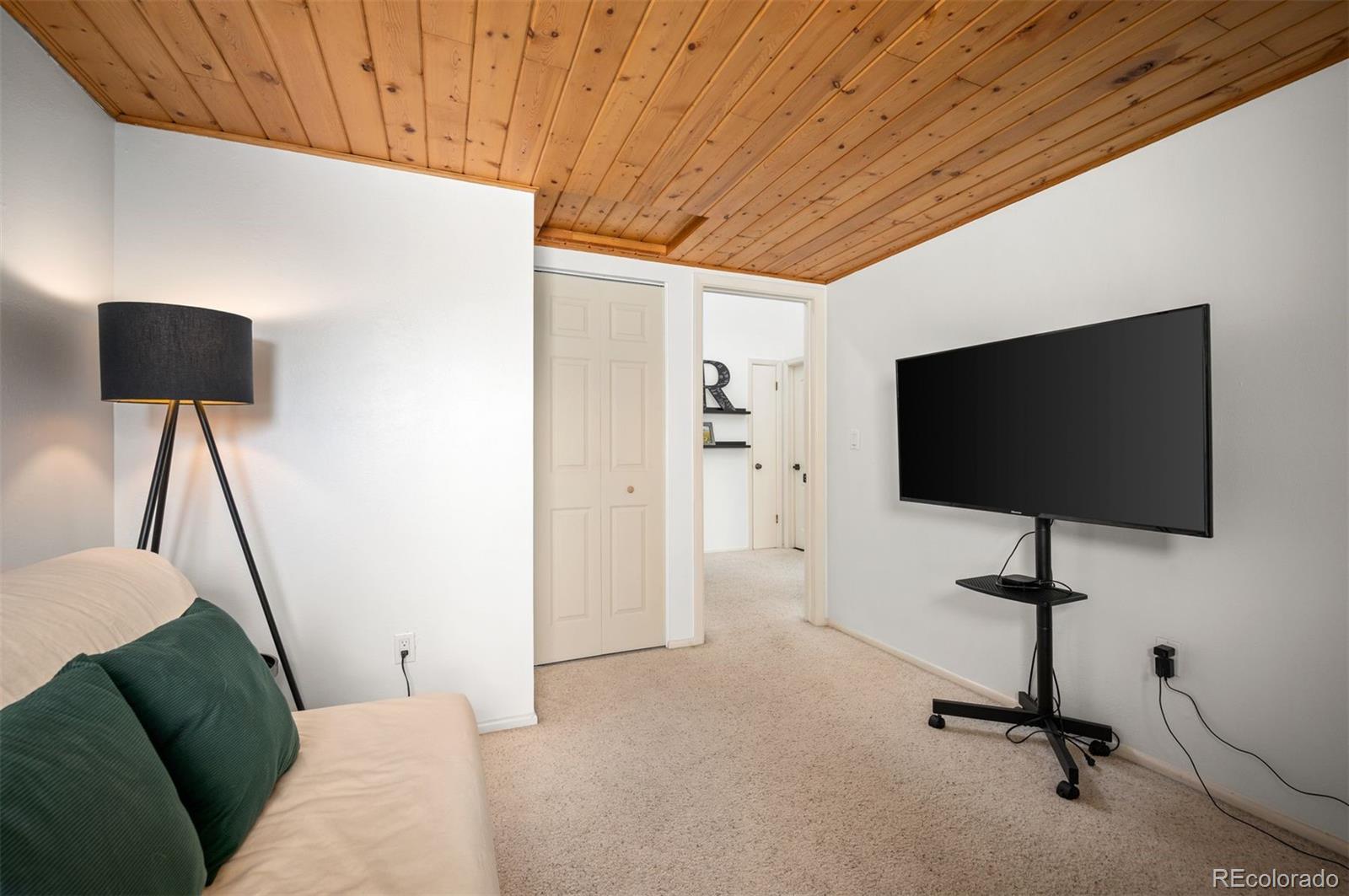 4367 East Maplewood Way Centennial, CO 80121 - Photo 20 of 26 a view of a livingroom with a flat screen tv
