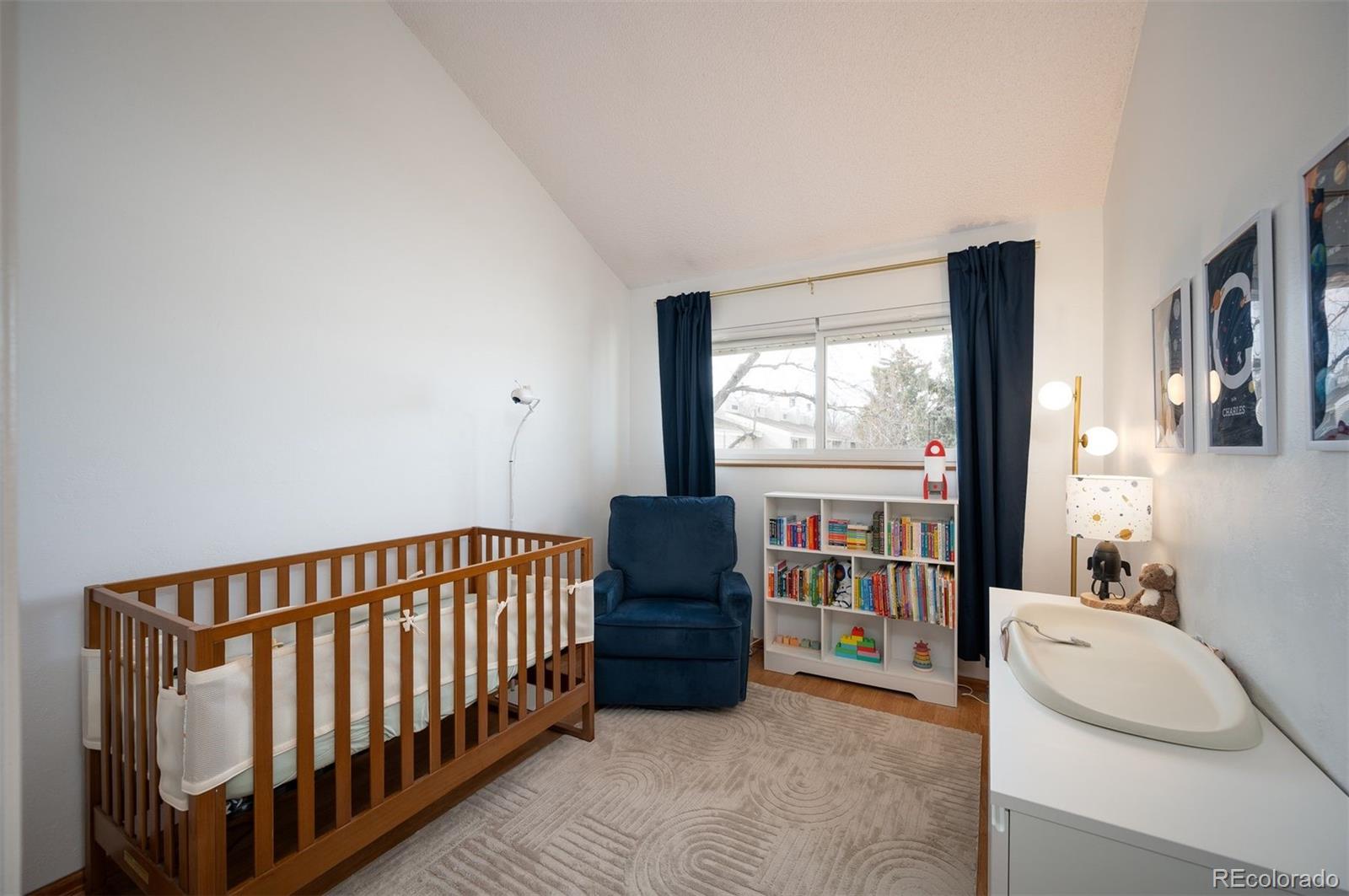 4367 East Maplewood Way Centennial, CO 80121 - Photo 21 of 26 a bedroom with furniture and a large window