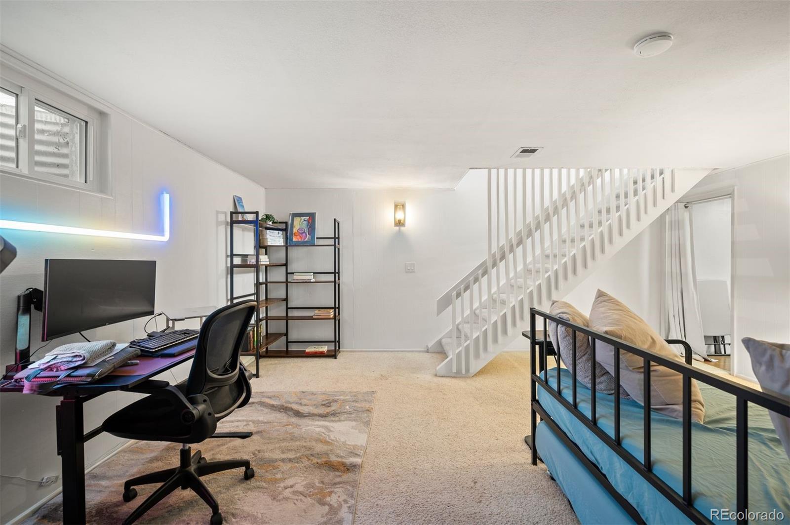 4367 East Maplewood Way Centennial, CO 80121 - Photo 22 of 26 a view of a workspace with wooden floor and furniture