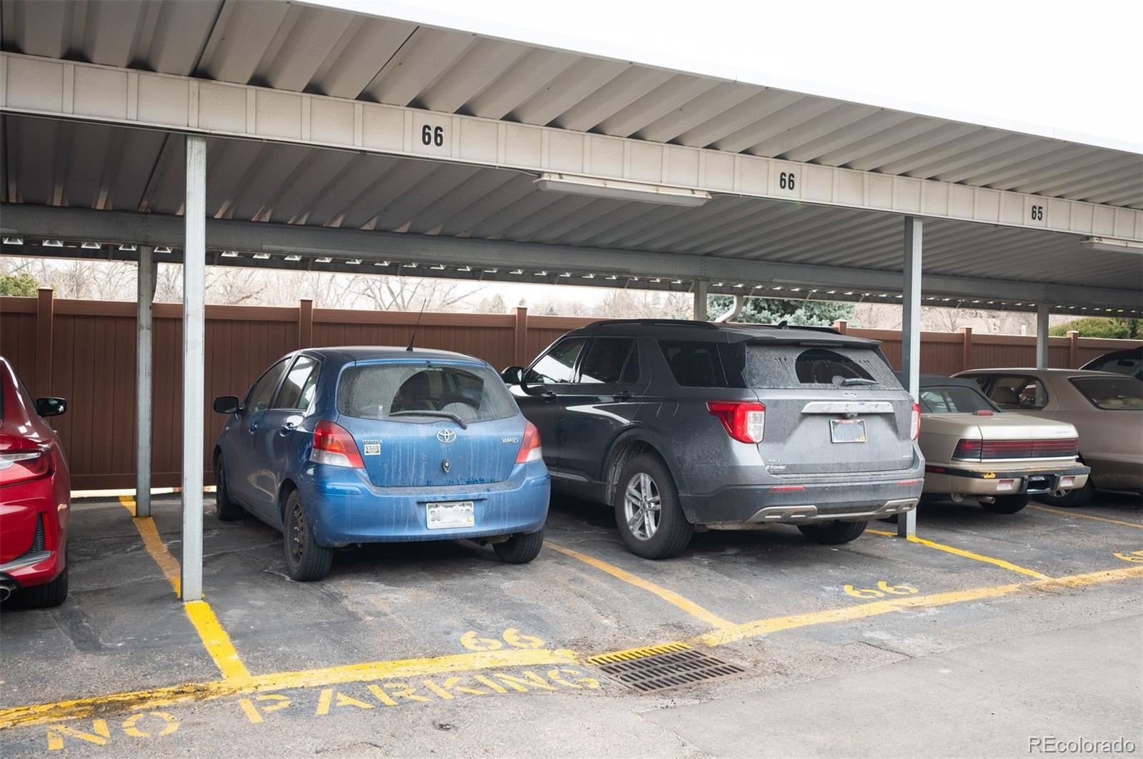 4367 East Maplewood Way Centennial, CO 80121 - Photo 25 of 26 a view of parking garage with cars