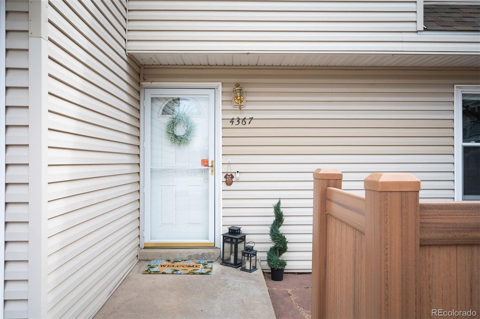 4367 East Maplewood Way Centennial, CO 80121 - Photo 26 of 26 a view of a door of a house with windows
