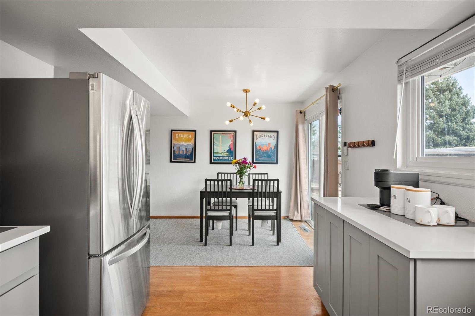 4367 East Maplewood Way Centennial, CO 80121 - Photo 3 of 26 a view of a kitchen and dining room