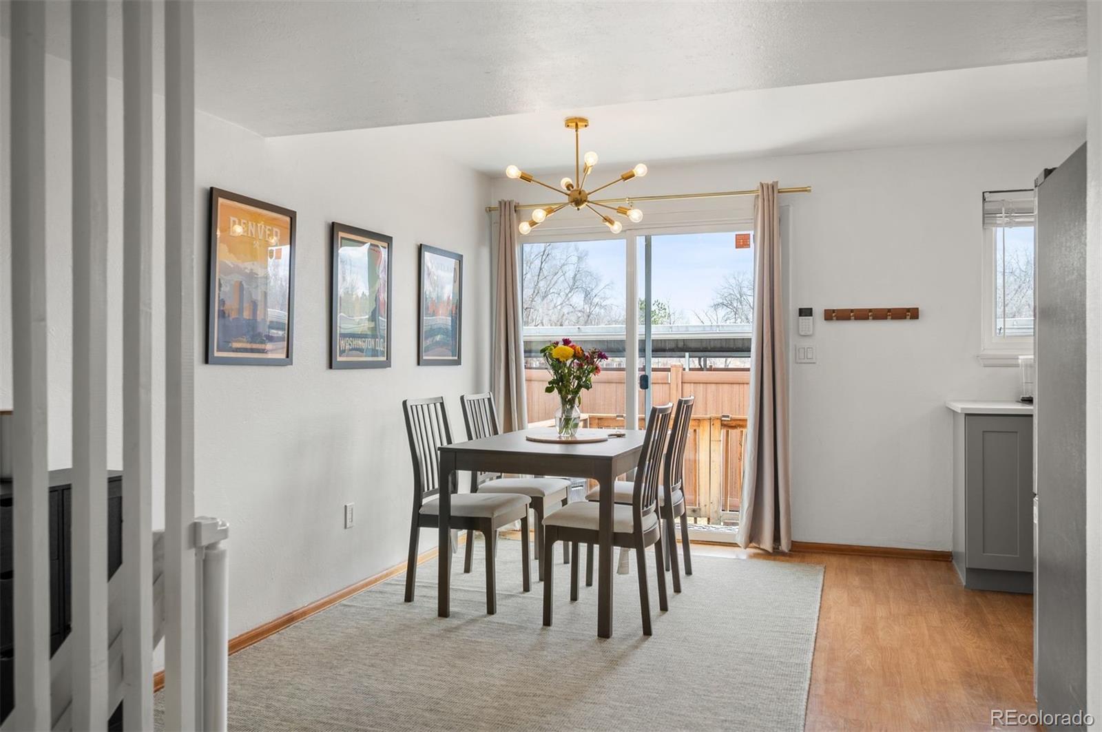 4367 East Maplewood Way Centennial, CO 80121 - Photo 7 of 26 a view of a dining room with furniture window and outside view