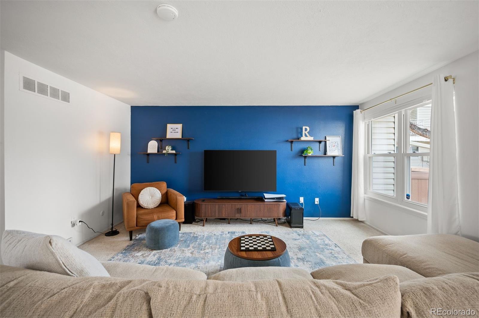 4367 East Maplewood Way Centennial, CO 80121 - Photo 8 of 26 a bedroom with bed and a window