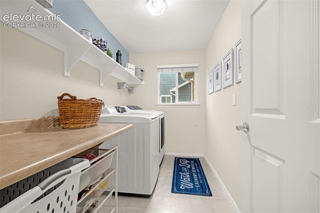 9127 Oakmont Road Peyton, CO 80831 - Photo 17 of 49 a utility room with dryer and washer