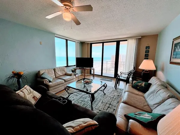 a living room with furniture and a large window