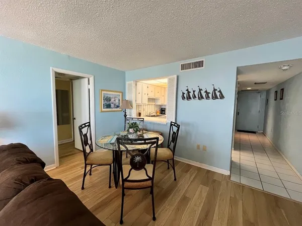 a view of a livingroom with furniture and wooden floor