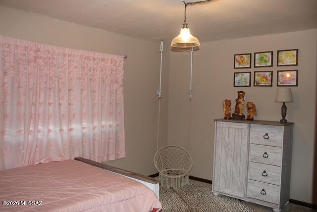 1201 East Old Stewart Road Willcox, AZ 85643 - Photo 31 of 49 a bedroom with a bed and a dresser in it