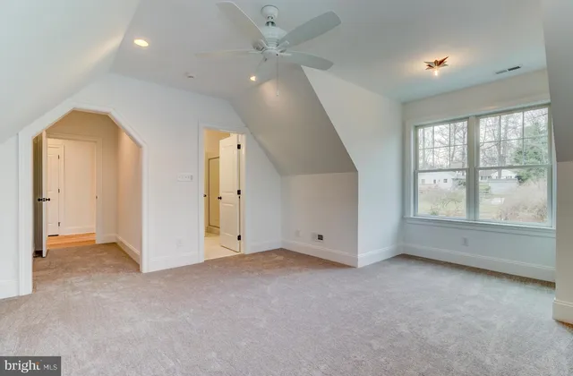 a spacious bathroom with a bathtub and 2 sink
