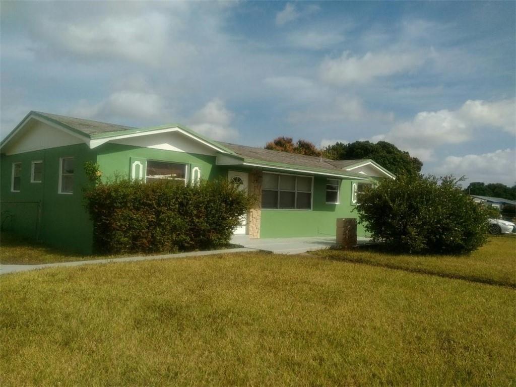 2951 Northwest 208th Terrace Miami Gardens, FL 33056 - Photo 1 of 10 a front view of a house with garden