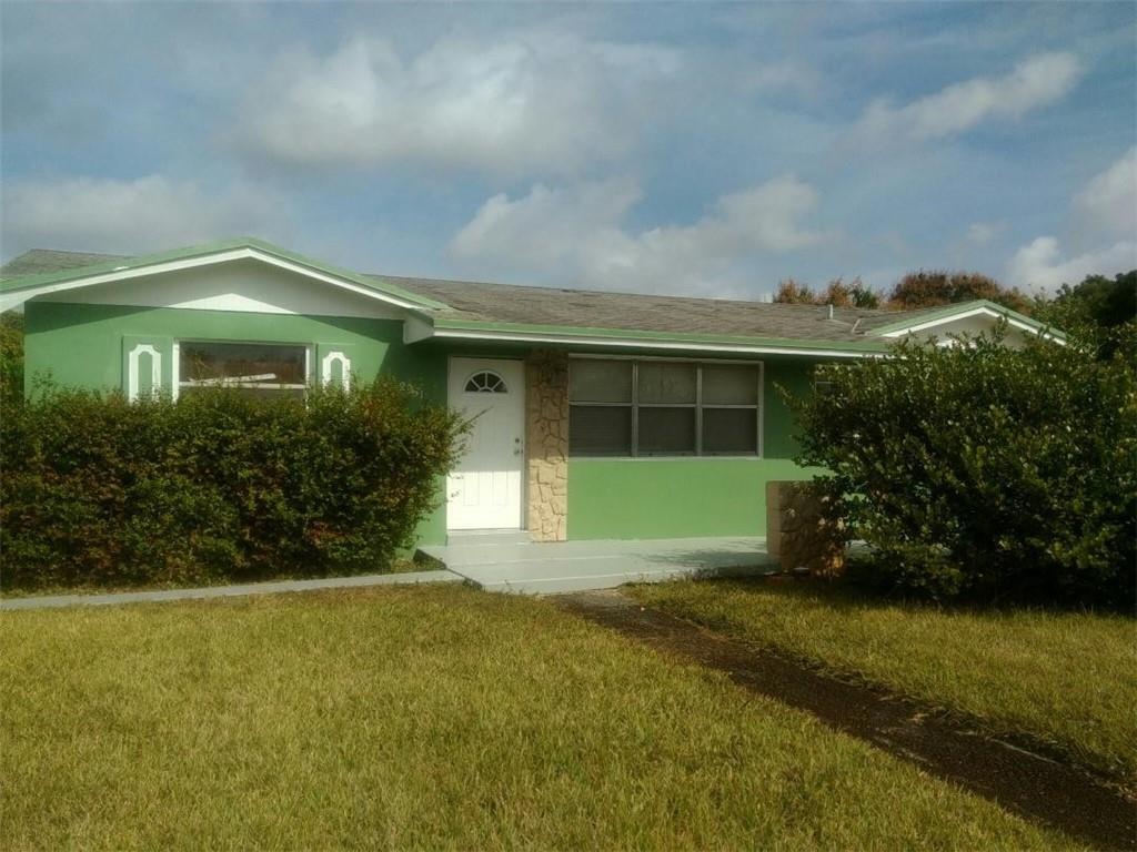 2951 Northwest 208th Terrace Miami Gardens, FL 33056 - Photo 4 of 10 a front view of house with yard and green space