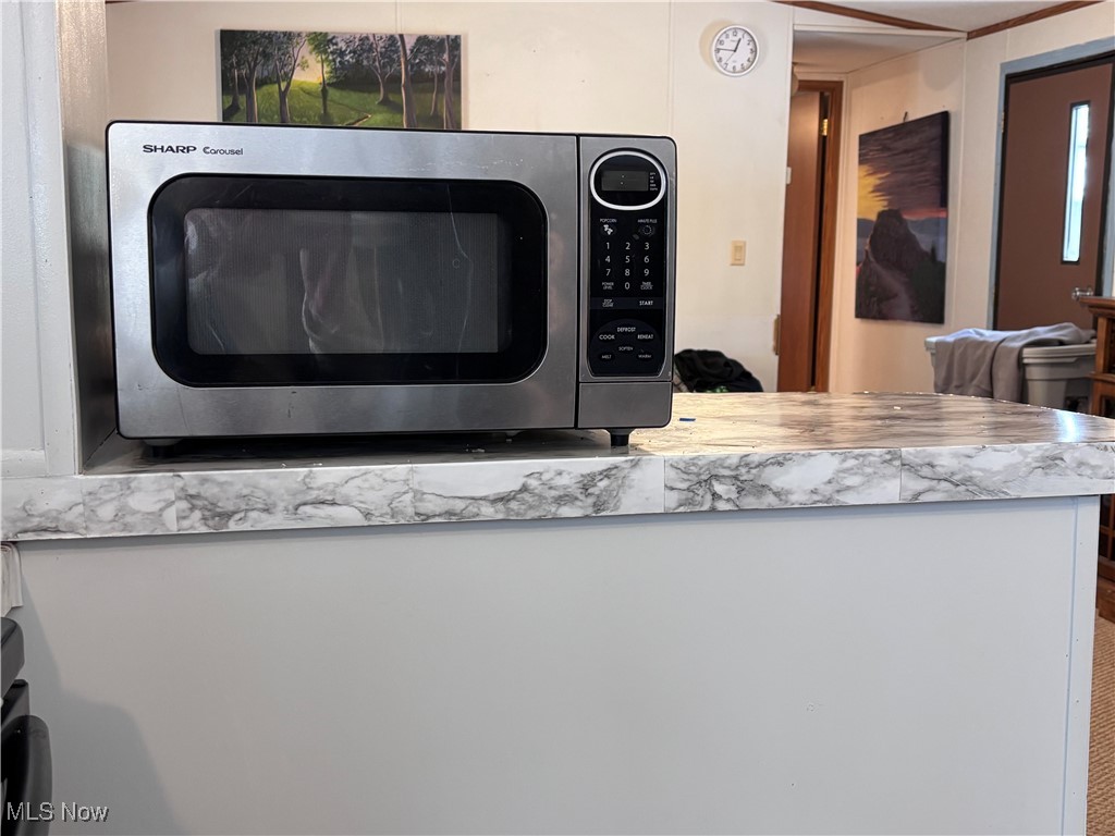 29311 Rabbit Ridge Road Howard, OH 43028 - Photo 9 of 39 Kitchen view of stainless steel microwave and light countertops
