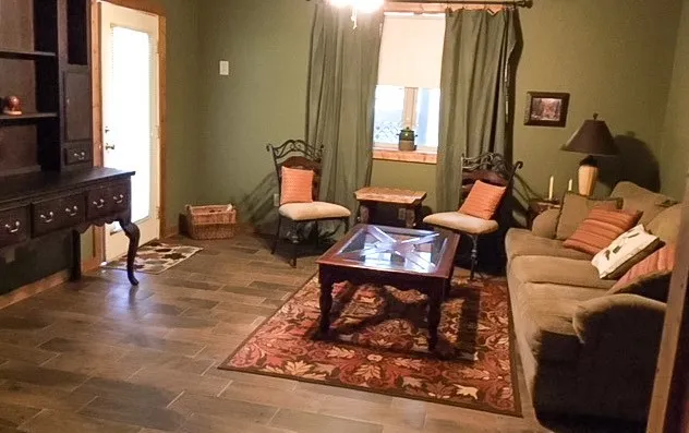 a living room with furniture windows and a fireplace