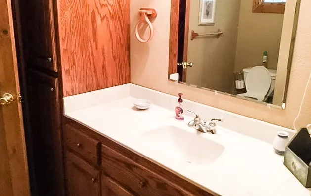 a bathroom with a sink and a mirror