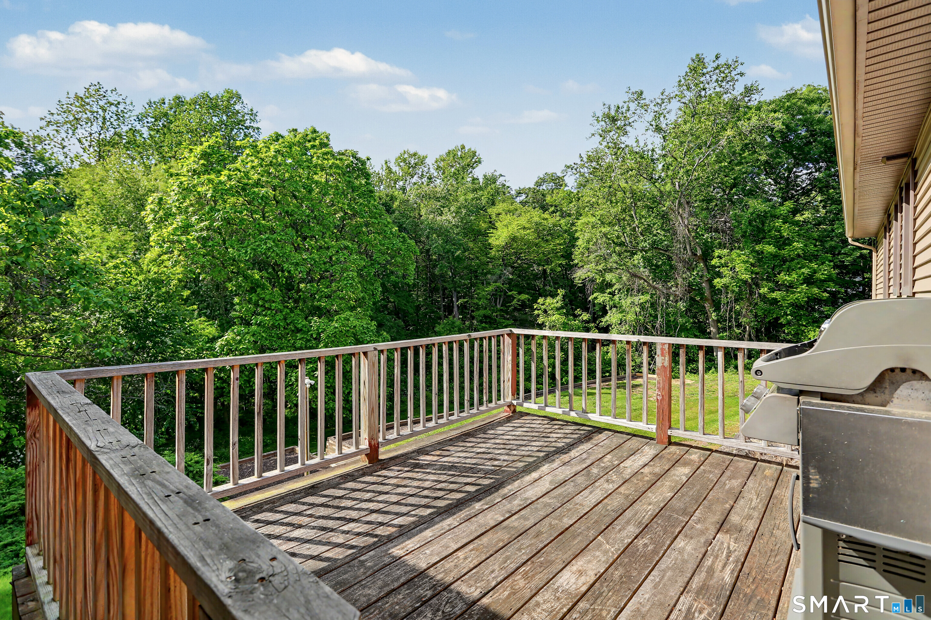 632 Wheelers Farm Road Orange, CT 06477 - Photo 30 of 39 a balcony with wooden floor and fence