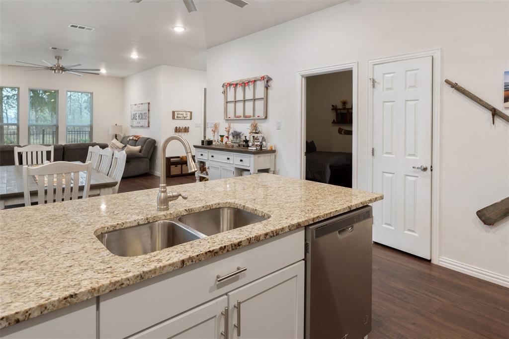 6156 Inca Drive Mabank, TX 75156 - Photo 14 of 30 a kitchen with a sink and a refrigerator