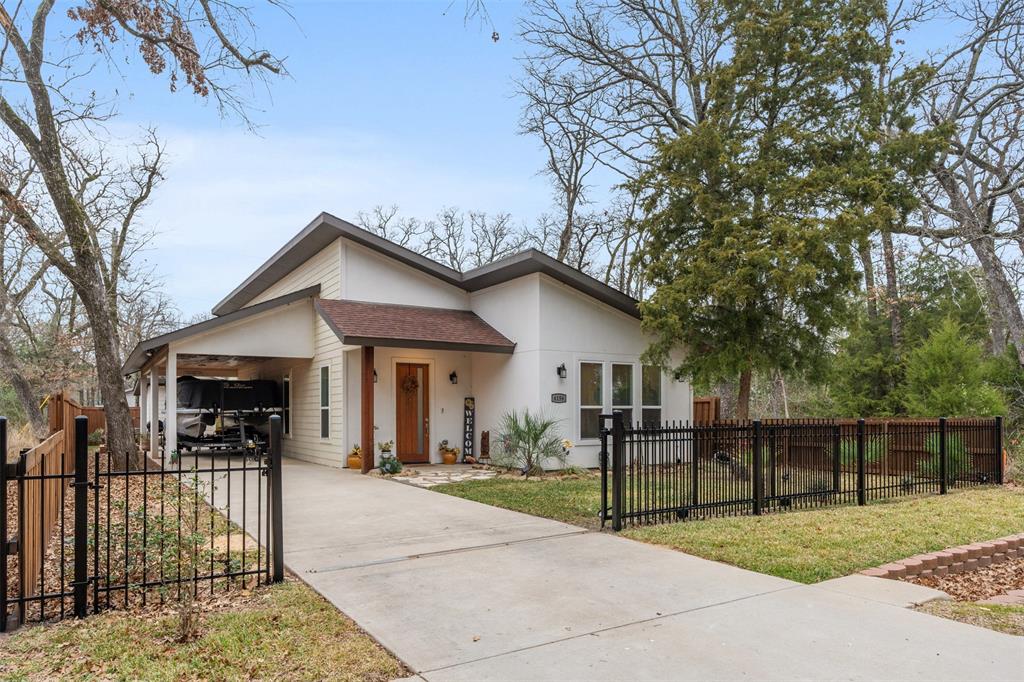 6156 Inca Drive Mabank, TX 75156 - Photo 4 of 30 a view of a house with wooden fence next to a road