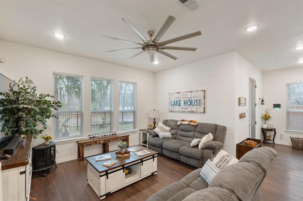 6156 Inca Drive Mabank, TX 75156 - Photo 7 of 30 a living room with furniture and a large window with wooden floor