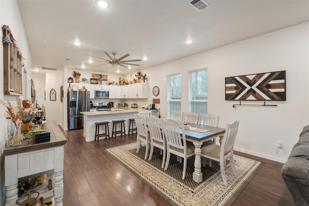 6156 Inca Drive Mabank, TX 75156 - Photo 10 of 30 a view of a dining room with furniture and wooden floor