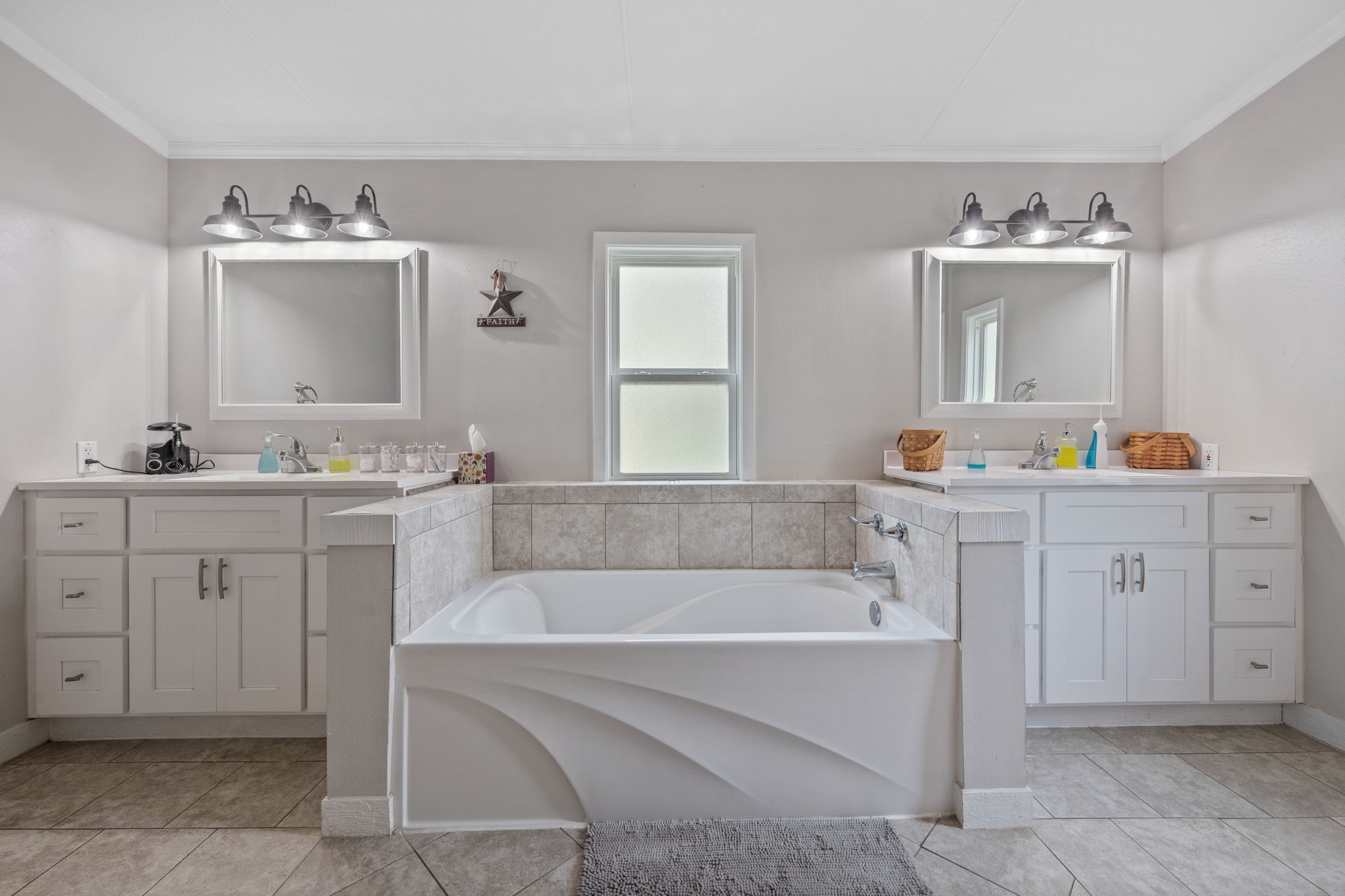161 W Creek Trinity, TX 75862 - Photo 14 of 22 a bathroom with a tub sink and mirror