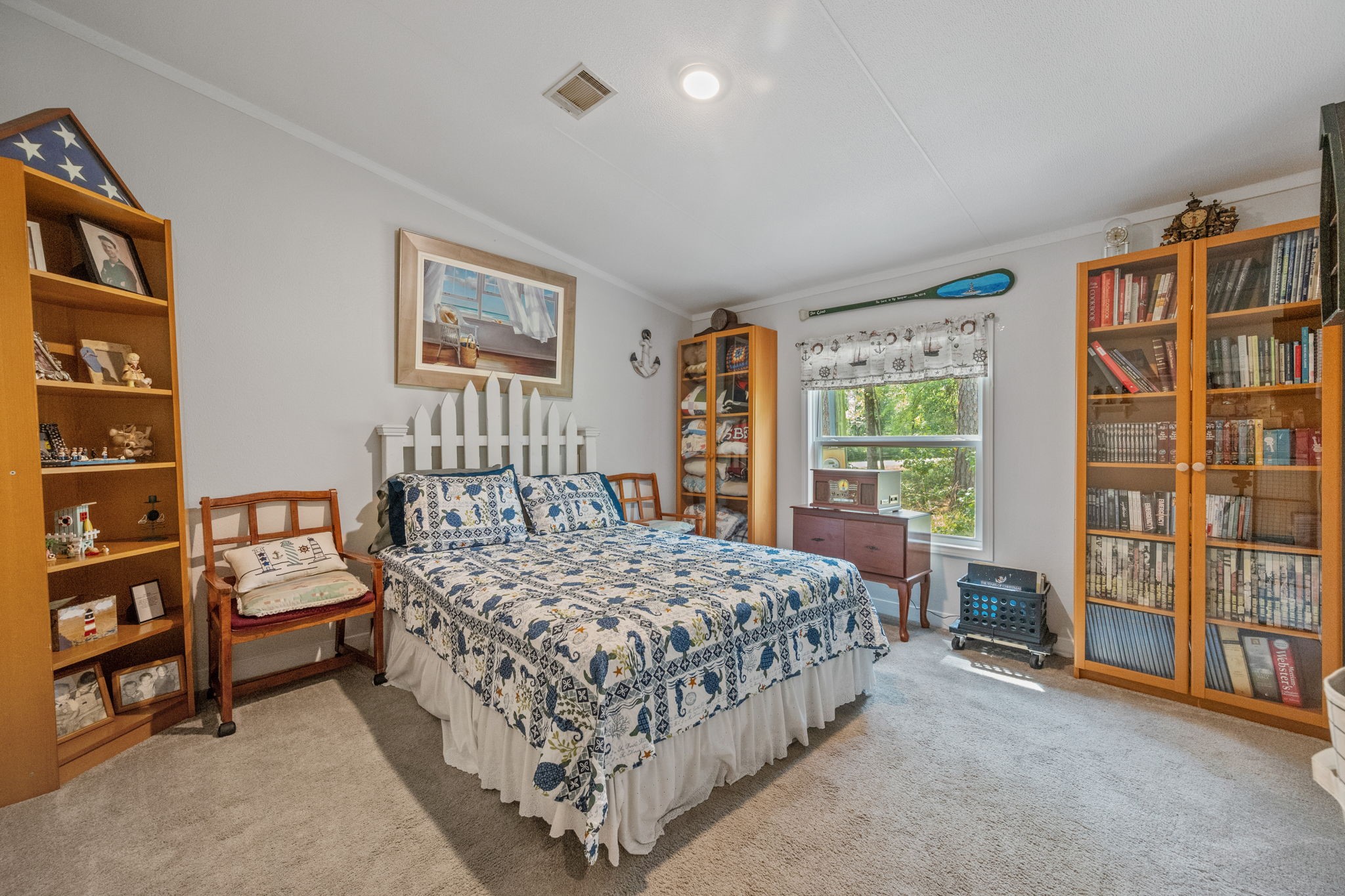 161 W Creek Trinity, TX 75862 - Photo 17 of 22 a bedroom with a bed furniture and a book shelf