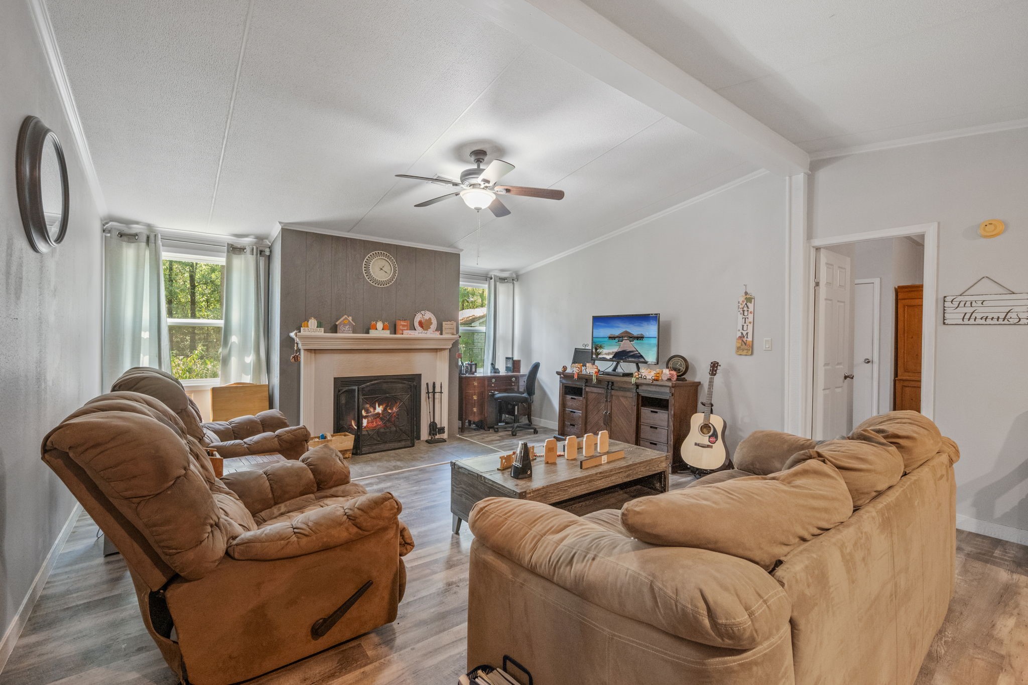 161 W Creek Trinity, TX 75862 - Photo 3 of 22 a living room with furniture a fireplace and a window