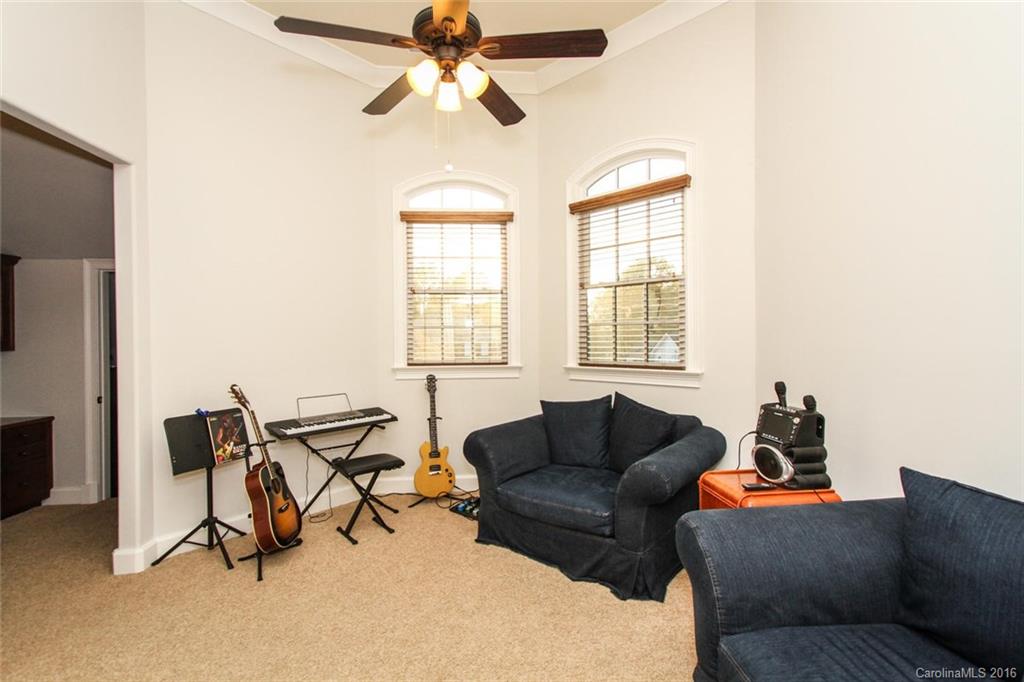 7227 Sheffingdell Drive Charlotte, NC 28226 - Photo 19 of 24 a living room with furniture and a window