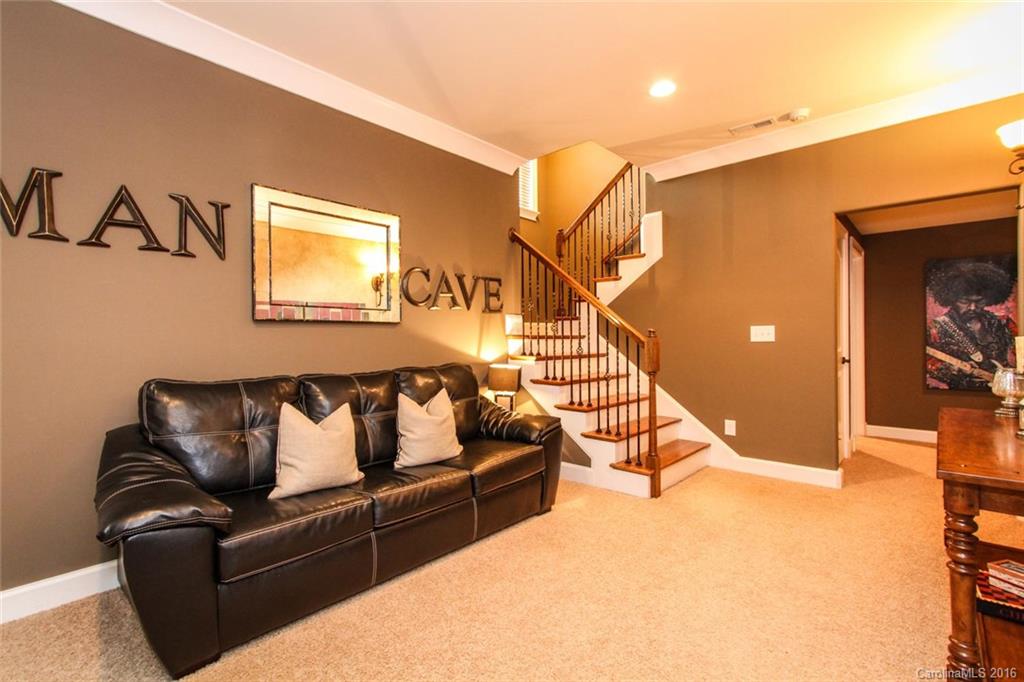7227 Sheffingdell Drive Charlotte, NC 28226 - Photo 21 of 24 a living room with furniture and stairs