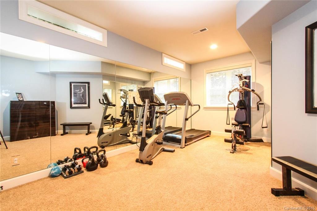 7227 Sheffingdell Drive Charlotte, NC 28226 - Photo 24 of 24 a view of a room with gym equipment