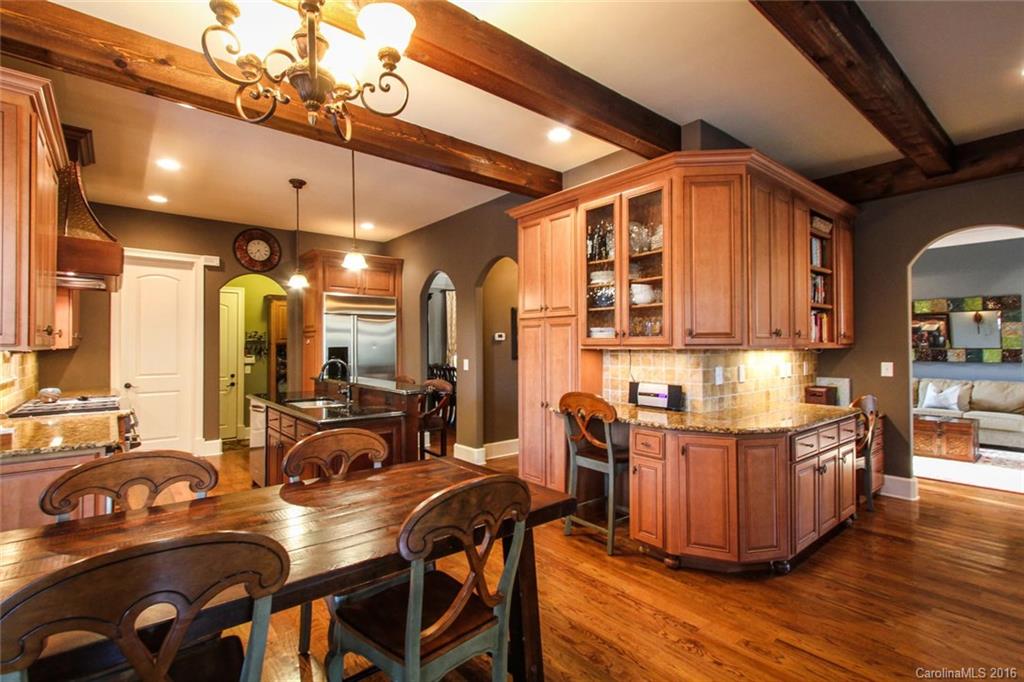 7227 Sheffingdell Drive Charlotte, NC 28226 - Photo 5 of 24 a view of a dining room with furniture and wooden floor