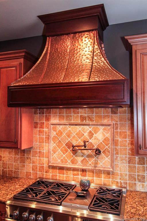 7227 Sheffingdell Drive Charlotte, NC 28226 - Photo 8 of 24 a kitchen with a sink and a stove