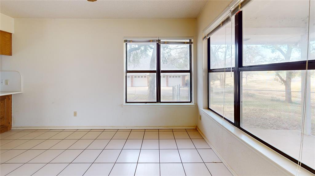 8927 Bontura Road Granbury, TX 76049 - Photo 11 of 23 a view of an empty room with a window