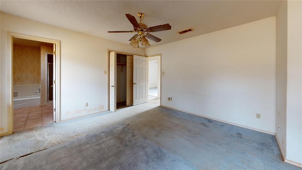 8927 Bontura Road Granbury, TX 76049 - Photo 13 of 23 a view of a livingroom with a ceiling fan and wooden floor