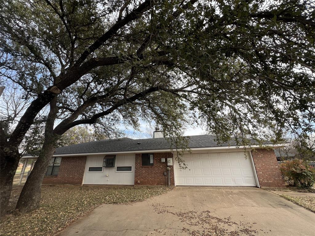 8927 Bontura Road Granbury, TX 76049 - Photo 21 of 23 a front view of house with yard and trees