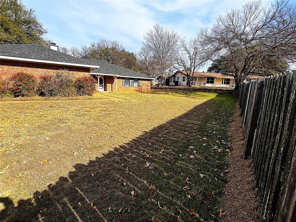 8927 Bontura Road Granbury, TX 76049 - Photo 22 of 23 a view of a yard with an outdoor space