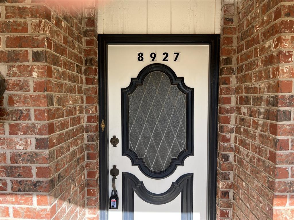 8927 Bontura Road Granbury, TX 76049 - Photo 3 of 23 a close view of a door and a shower in a bathroom