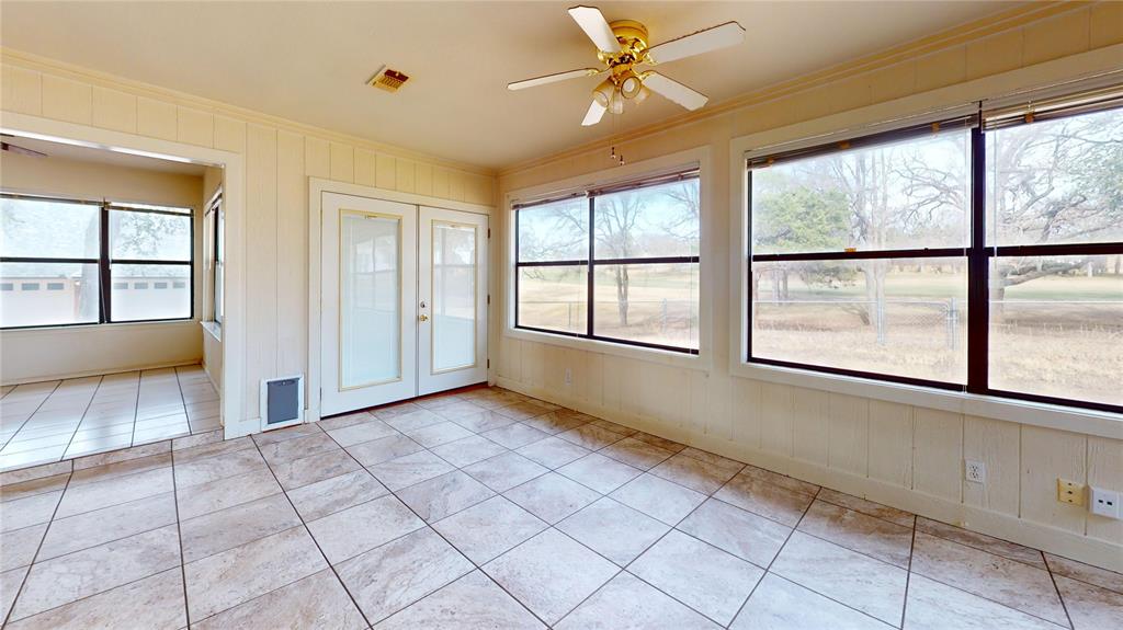 8927 Bontura Road Granbury, TX 76049 - Photo 4 of 23 a view of an empty room with a window